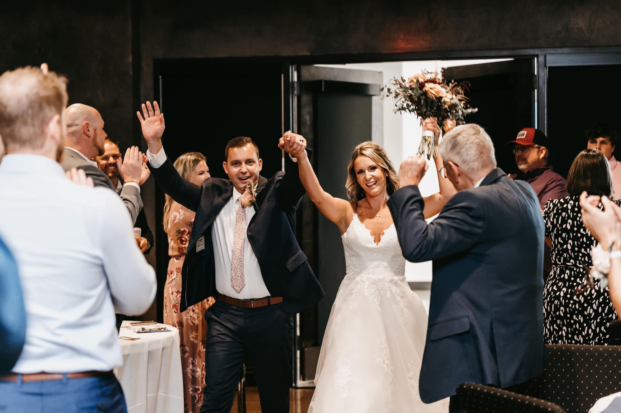 A newly married couple entering their reception at The Steam Plant
